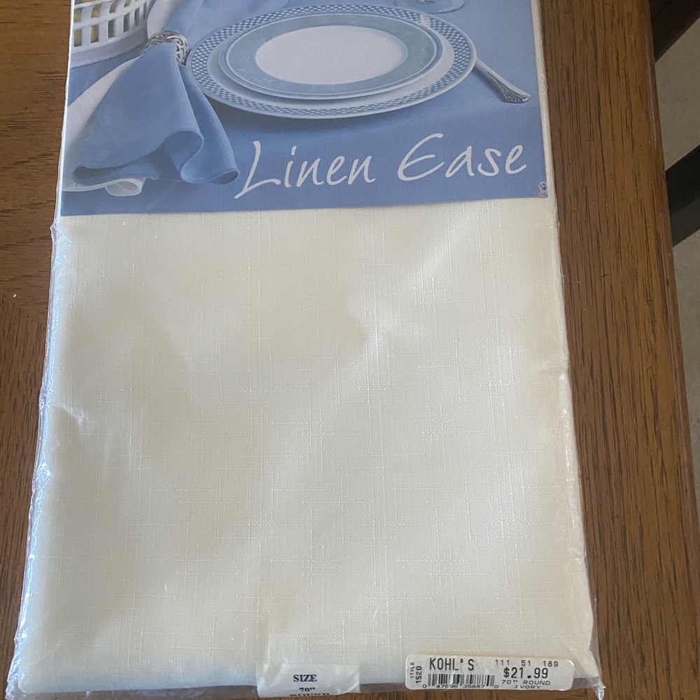 New 70” round Linen Ease tablecloth, cream.